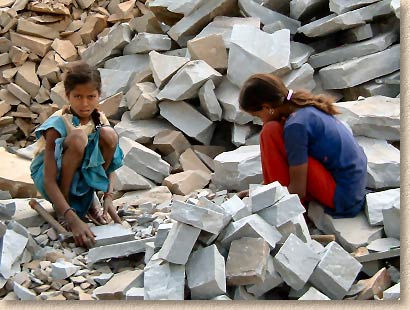children cutting stone