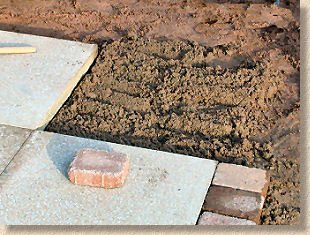 how to lay slabs on sand and cement
