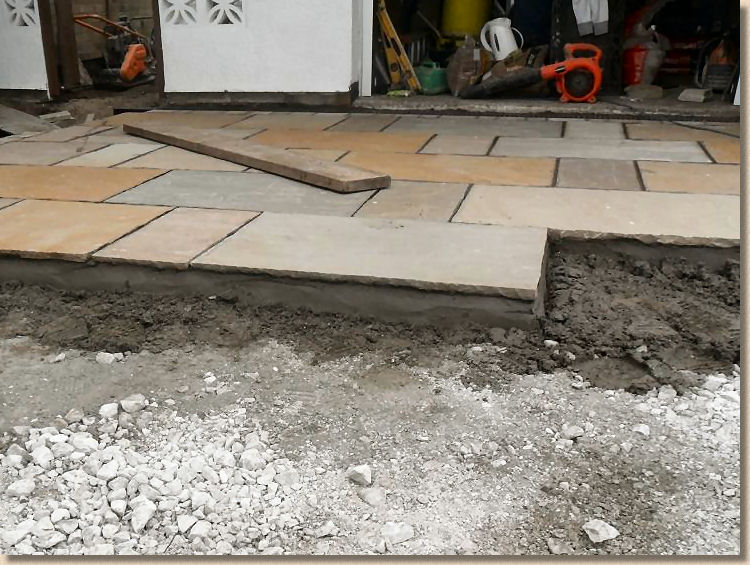 laying flagstone on concrete